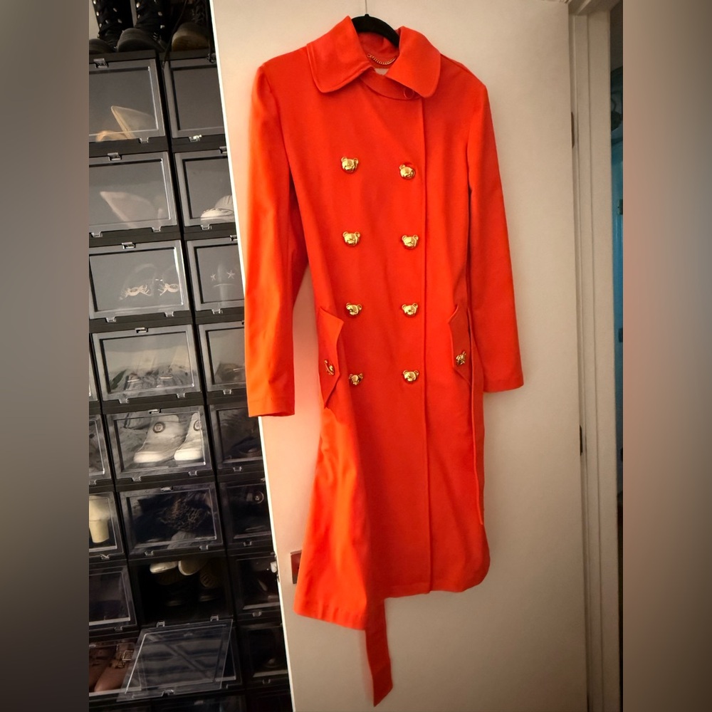 Moschino Couture Vibrant Orange Trench Coat with Gold Bear Buttons and Belt.